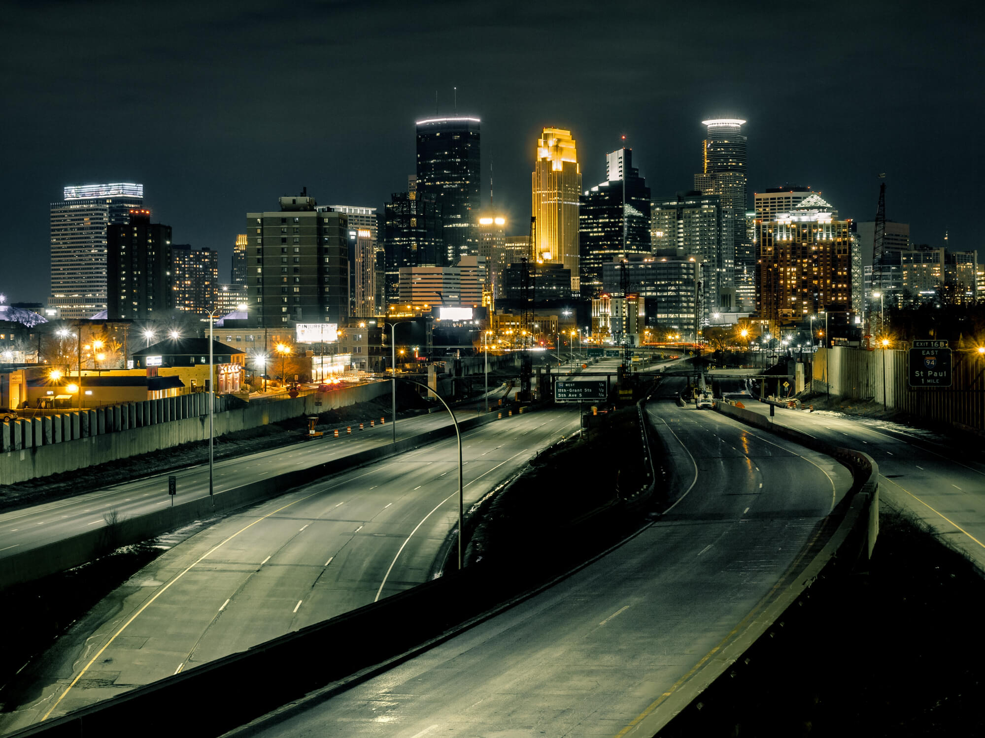 High Angle View Of Illuminated Street Amidst Buildings In Downtown Minneapolis At Night